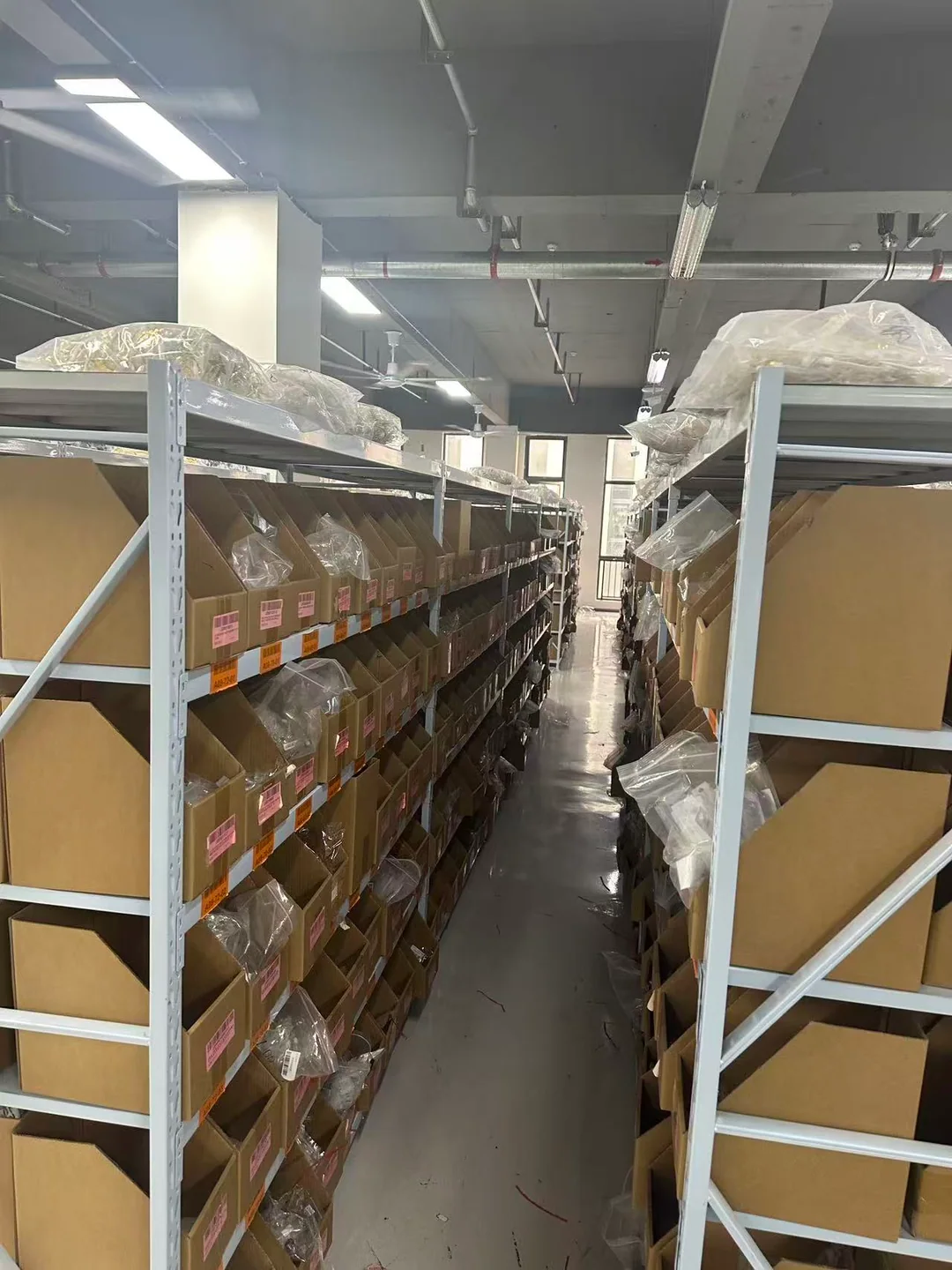 Warehouse aisle with organized stock shelves
